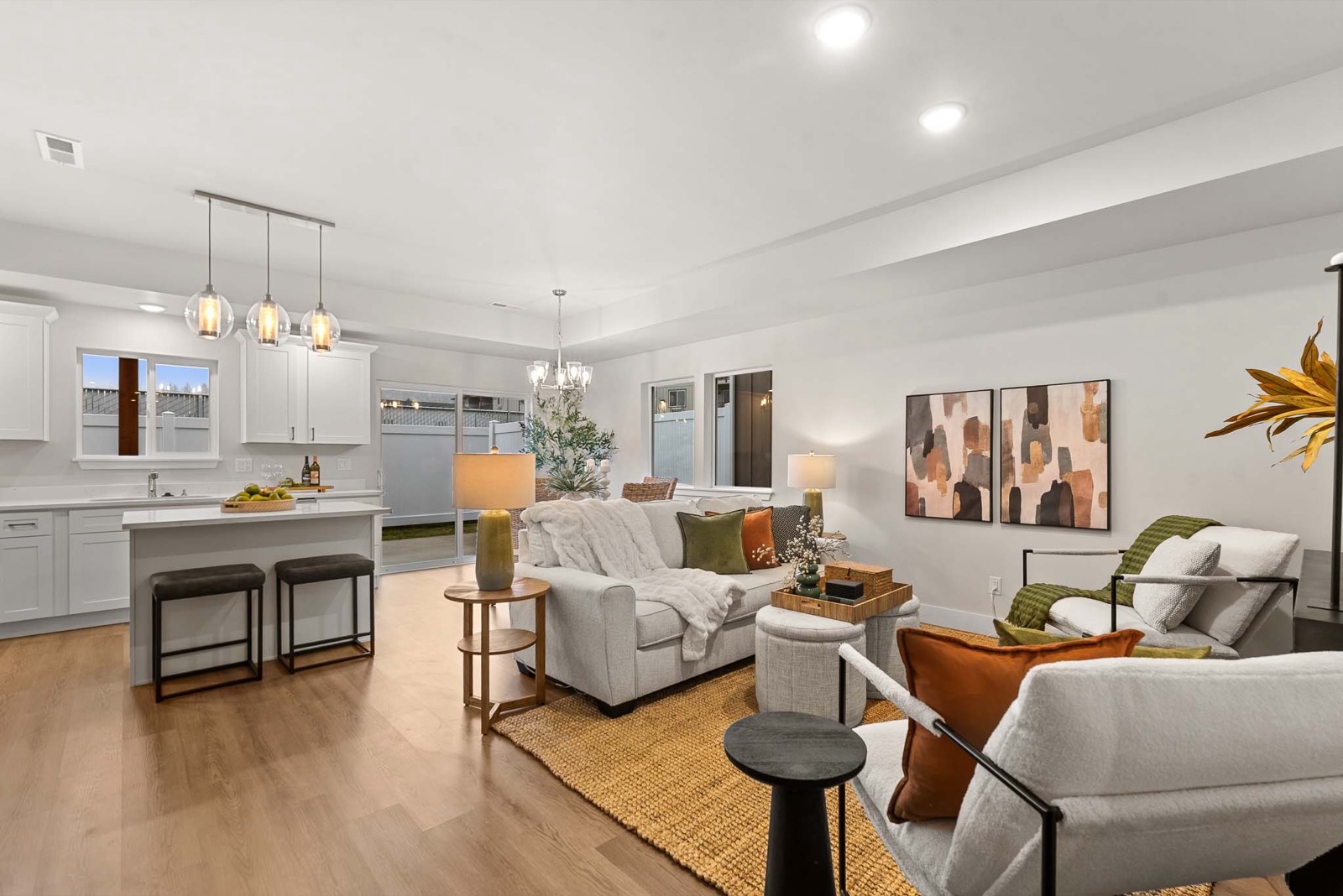 Open living and kitchen at Red Apple with staged furniture and patio beyond